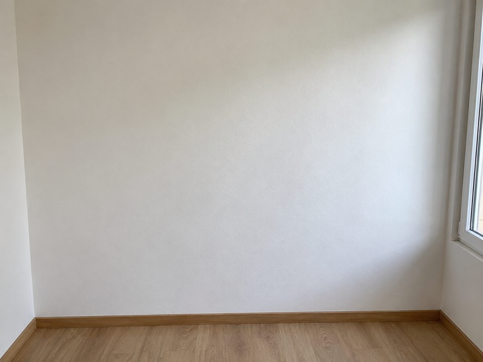 Bedroom wall at move-in: clean, no marks